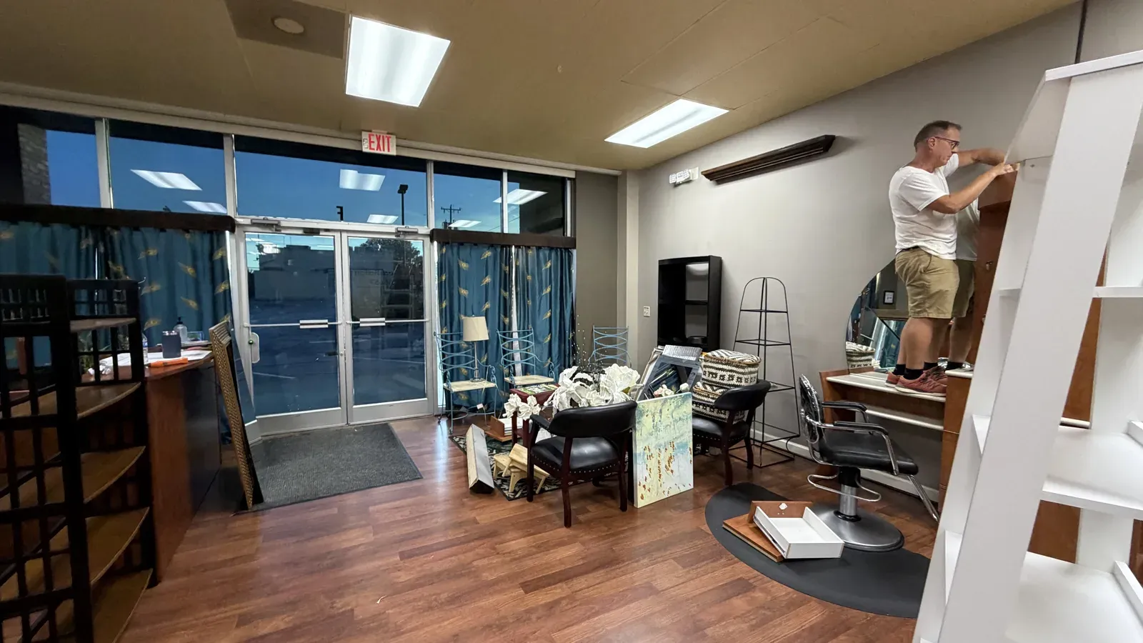 The front of the old salon, cluttered, before the rebuild