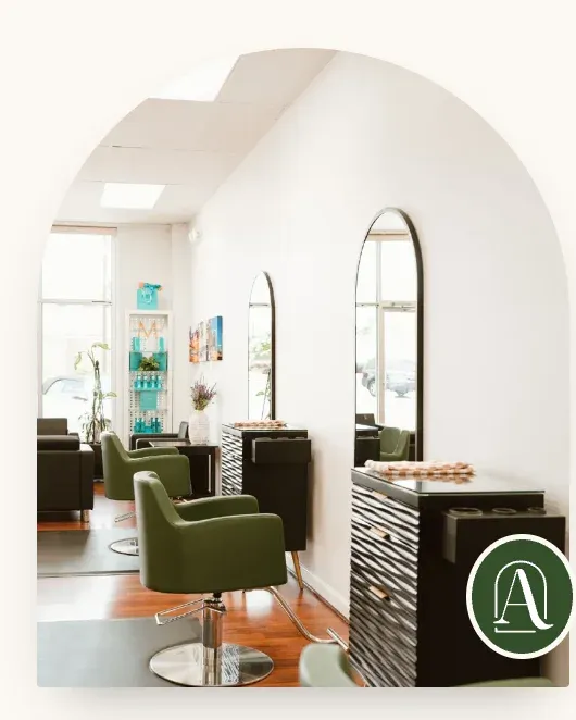 An arched photograph of the salon with the green Adelaide mark on its corner