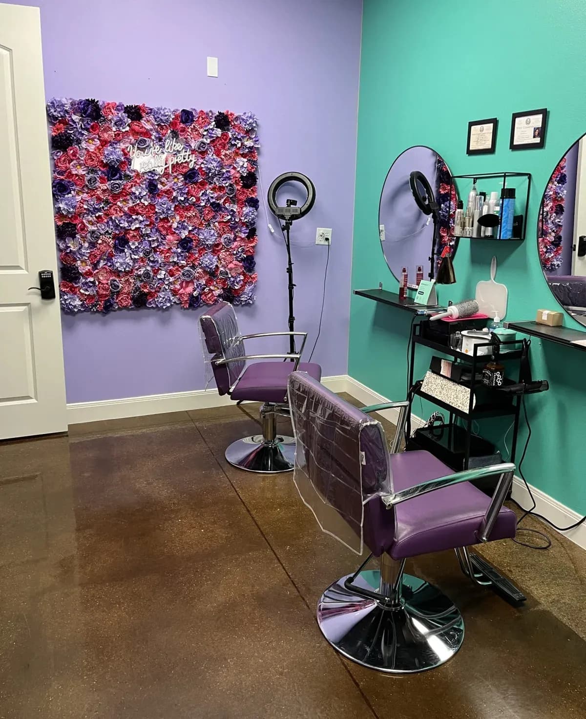 A purple and teal suite with a flower wall