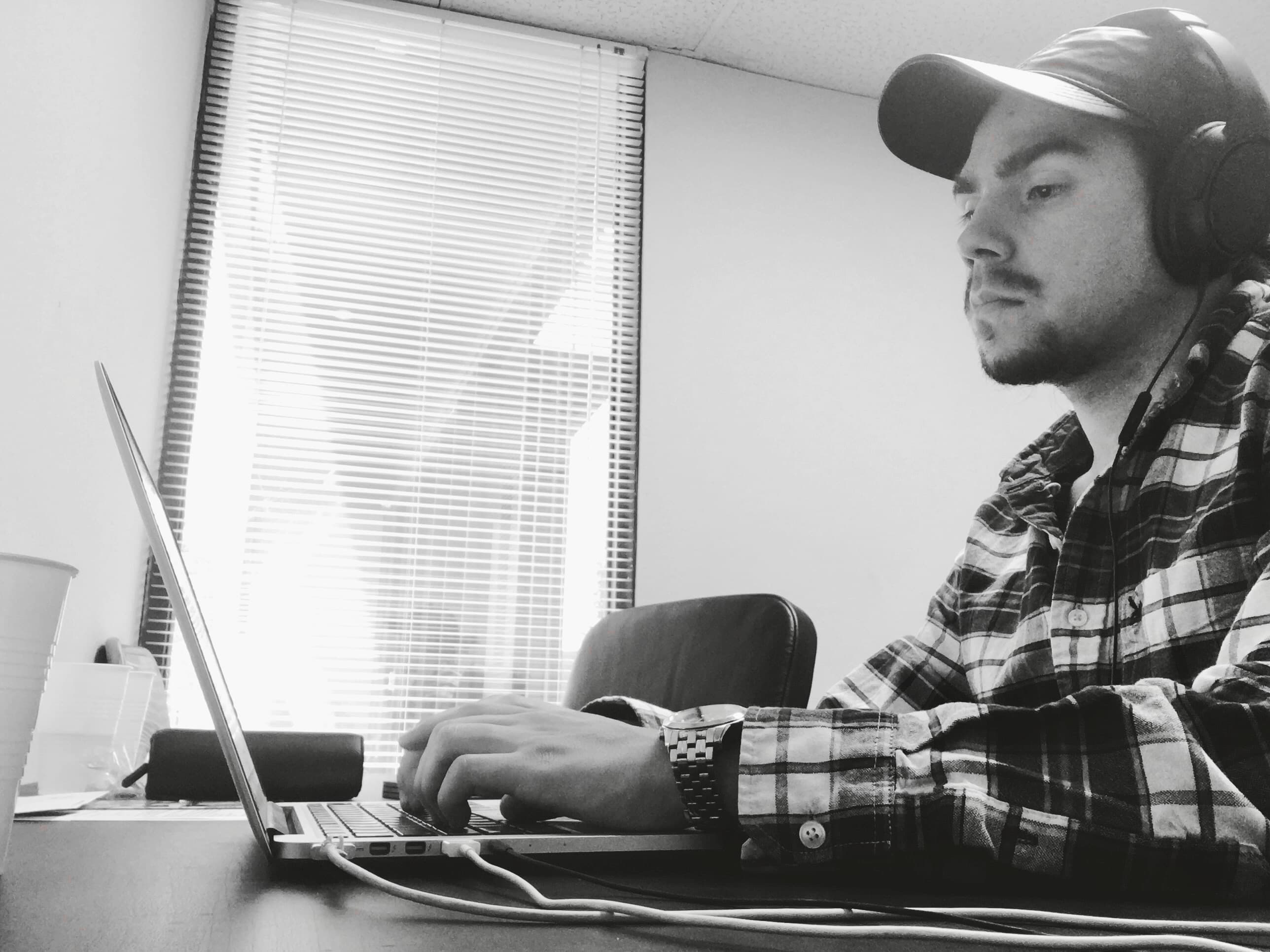 Matt working on a laptop in the early days of Salon Boss