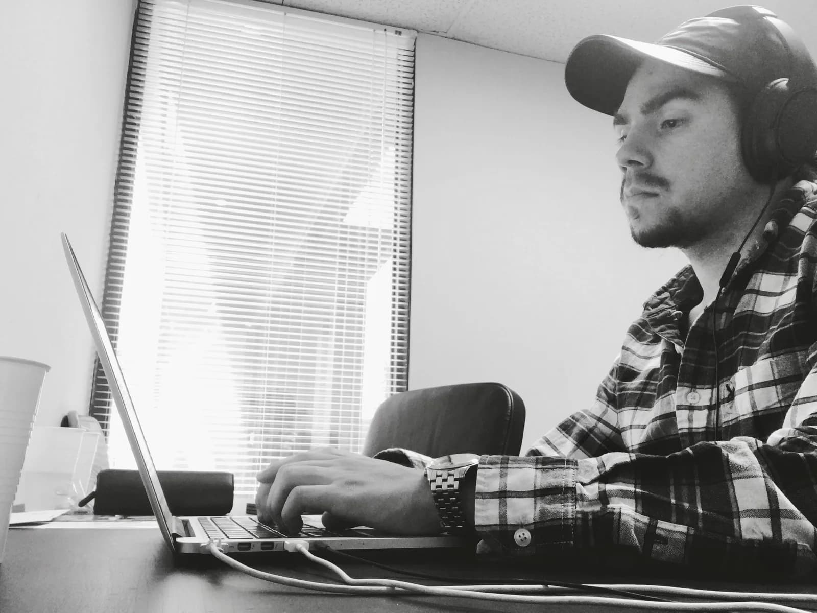 Matt working on a laptop in the early days of Salon Boss